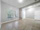 Bright and spacious living room features tile floors, natural light, and neutral paint at 1401 Parker Den Dr, Ruskin, FL 33570