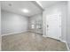 Bright and spacious living room features tile floors and natural light from large windows at 1401 Parker Den Dr, Ruskin, FL 33570