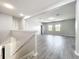 A bright loft that features hardwood floors and a staircase at 1401 Parker Den Dr, Ruskin, FL 33570
