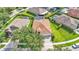 Aerial view of home featuring a well-manicured lawn and a long driveway leading to the garage at 15706 Starling Water Dr, Lithia, FL 33547