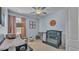 Cozy Bedroom featuring soft blue walls, a grey crib, and a charming ceiling fan with stars at 15706 Starling Water Dr, Lithia, FL 33547