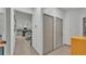 Inviting hallway with neutral tones leading to an open kitchen and living area, showcasing the home's layout at 15706 Starling Water Dr, Lithia, FL 33547