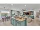 Open kitchen island with granite countertop, breakfast bar, and views of the living room and dining area at 15706 Starling Water Dr, Lithia, FL 33547