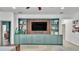 Stylish living room with built-in shelving and drawers, and decorative items on the shelves at 15706 Starling Water Dr, Lithia, FL 33547