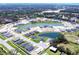 New homes surround a tranquil lake in a Primary-planned community with mature trees and landscaping at 2512 58Th E Cir, Palmetto, FL 34221