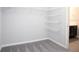 Large walk-in closet with wire shelving that maximizes storage, and plush carpeting at 2512 58Th E Cir, Palmetto, FL 34221