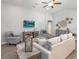Comfortable living room featuring stylish furnishings, ample seating, and a large television at 2556 58Th E Cir, Palmetto, FL 34221