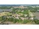 A panoramic aerial perspective of a property surrounded by lush greenery at 4020 Mcintosh Rd, Dover, FL 33527