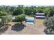 Wide aerial view of the home, the garage and what appears to be a barn outbuilding at 4020 Mcintosh Rd, Dover, FL 33527