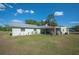 A covered patio area is off the back of the home, a great place to relax at 4020 Mcintosh Rd, Dover, FL 33527