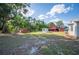 A few utility buildings are present in this large open backyard at 4020 Mcintosh Rd, Dover, FL 33527