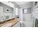 Beautifully renovated bathroom with granite vanity and shower and tub combo at 4020 Mcintosh Rd, Dover, FL 33527