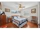 Bright bedroom features hardwood floors, ample natural light, and simple decor at 4020 Mcintosh Rd, Dover, FL 33527
