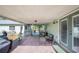 Covered patio with brick flooring, outdoor seating, and lighting fixtures, perfect for entertaining at 4020 Mcintosh Rd, Dover, FL 33527
