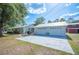Lovely home with a two-car detached garage and a well-maintained lawn at 4020 Mcintosh Rd, Dover, FL 33527