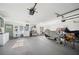 Large garage space with ample storage and appliances at 4020 Mcintosh Rd, Dover, FL 33527