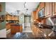 Well-equipped kitchen featuring custom wood cabinets and stainless steel appliances at 4020 Mcintosh Rd, Dover, FL 33527