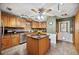 Charming kitchen featuring custom wood cabinetry, a center island, and modern stainless steel appliances at 4020 Mcintosh Rd, Dover, FL 33527