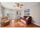 Inviting living room with french doors to the backyard and hardwood floors at 4020 Mcintosh Rd, Dover, FL 33527