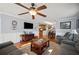 Relaxing living room with hardwood floors, wainscoting, and views into the kitchen and dining area at 4020 Mcintosh Rd, Dover, FL 33527