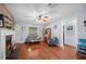 Inviting living room with hardwood floors, fireplace, and a cozy seating area at 4020 Mcintosh Rd, Dover, FL 33527