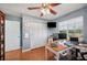 Spacious office features hardwood floors, a ceiling fan, and ample natural light at 4020 Mcintosh Rd, Dover, FL 33527
