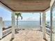 Spacious back porch provides stunning water views and a seamless transition to outdoor relaxation by the beach at 4778 Coquina Key Se Dr # 4778, St Petersburg, FL 33705