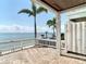 Spacious back porch provides stunning water views and a seamless transition to outdoor relaxation by the beach at 4778 Coquina Key Se Dr # 4778, St Petersburg, FL 33705