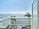 Balcony with comfortable seating and panoramic views of the beautiful blue ocean at 4778 Coquina Key Se Dr # 4778, St Petersburg, FL 33705