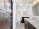 Bathroom boasts a double vanity with granite countertops, a walk-in shower and closet at 4778 Coquina Key Se Dr # 4778, St Petersburg, FL 33705