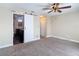 Bedroom has carpet and a sliding barn door leads into an en-suite bathroom at 4778 Coquina Key Se Dr # 4778, St Petersburg, FL 33705