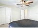 Bedroom with neutral walls, carpet, and double closets offer ample storage and a relaxing atmosphere at 4778 Coquina Key Se Dr # 4778, St Petersburg, FL 33705
