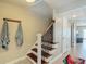 Entryway with a staircase, coat hooks, and wood-look flooring at 4778 Coquina Key Se Dr # 4778, St Petersburg, FL 33705
