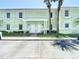 Charming two-story condo with white shutters and a welcoming pergola over the front doors at 4778 Coquina Key Se Dr # 4778, St Petersburg, FL 33705