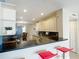 Open concept kitchen with counter seating and views of dining area and refrigerator at 4778 Coquina Key Se Dr # 4778, St Petersburg, FL 33705