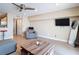 Living room features tile flooring, modern furniture, and large windows for natural light at 4778 Coquina Key Se Dr # 4778, St Petersburg, FL 33705