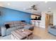 This open living area features stylish furniture and an adjacent kitchen with bar seating at 4778 Coquina Key Se Dr # 4778, St Petersburg, FL 33705
