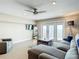 Bright living room featuring tile floors, modern furnishings, and french doors with beautiful water view at 4778 Coquina Key Se Dr # 4778, St Petersburg, FL 33705