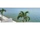 Breathtaking water view from the backyard, with palm trees adding a tropical touch to the serene scenery at 4778 Coquina Key Se Dr # 4778, St Petersburg, FL 33705