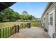 The back deck with a grill and a view of the backyard, providing ample space for outdoor gatherings at 6433 Mangrove Dr, Wesley Chapel, FL 33544