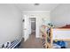 A bedroom with a playful atmosphere, featuring a bunk bed, and a view into the bathroom at 6433 Mangrove Dr, Wesley Chapel, FL 33544