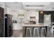 Spacious open concept kitchen with stainless steel appliances, a large island, and eat-in dining area at 6433 Mangrove Dr, Wesley Chapel, FL 33544