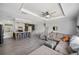 Bright open-concept living room with an island and comfortable seating area at 6433 Mangrove Dr, Wesley Chapel, FL 33544