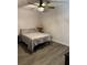 Serene bedroom with a comfortable bed, ceiling fan, and a calm, neutral color scheme at 135 Wild Palm Dr, Bradenton, FL 34210