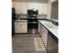 A kitchen with stainless appliances, white cabinets, and light countertops at 135 Wild Palm Dr, Bradenton, FL 34210