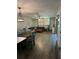 A spacious living area with wood-look floors, stylish decor, and plenty of natural light at 135 Wild Palm Dr, Bradenton, FL 34210