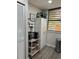 Well-organized pantry with storage shelves, coffee maker, and a window that provides lots of natural light at 135 Wild Palm Dr, Bradenton, FL 34210