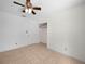 A comfortable bedroom features a ceiling fan and closet at 3205 N 66Th St, Tampa, FL 33619