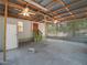 Large garage featuring a fan, concrete floor and potential for multiple uses at 3205 N 66Th St, Tampa, FL 33619