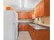 Kitchen features light-colored cabinets, stone countertops, and stainless steel sink and faucet at 3205 N 66Th St, Tampa, FL 33619